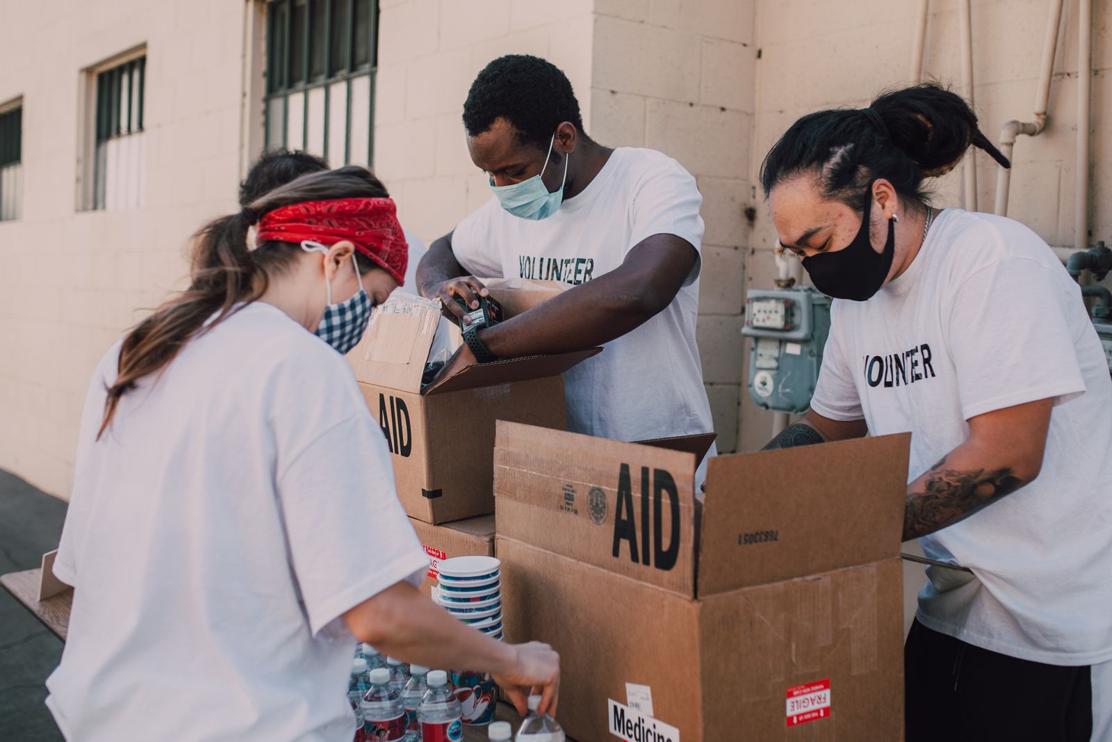 Volunteers packing hygiene and relief supplies into care boxes